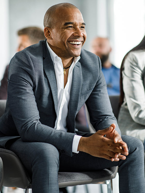office worker smiling at events and presentation