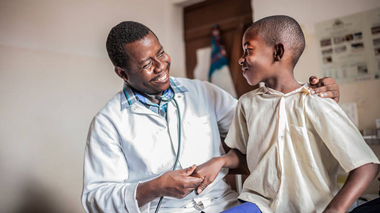 African male doctor examining child thumbnail