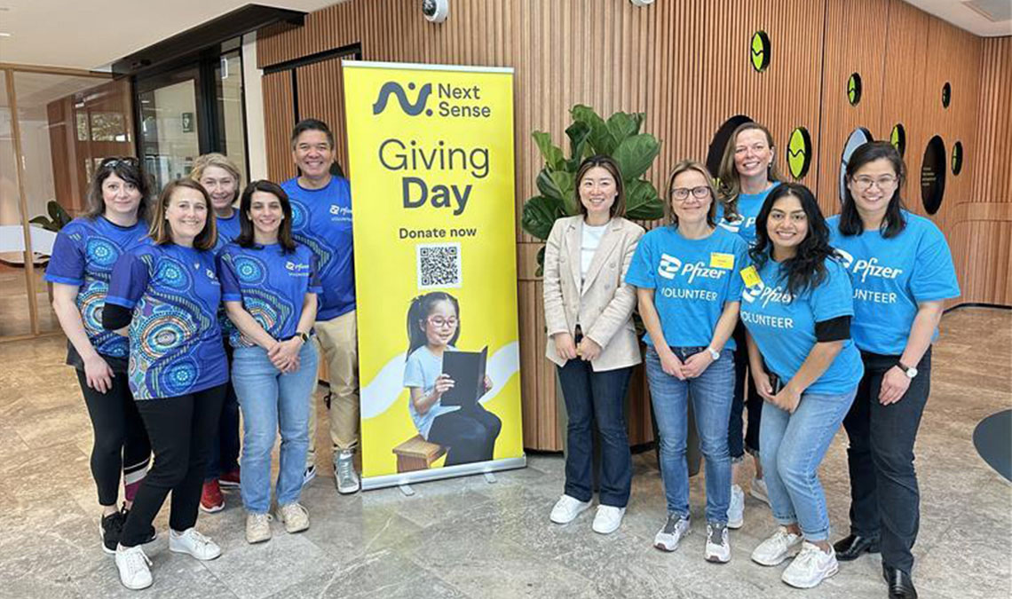 pfizer colleagues - volunteers taking a group photo for 175 days of good