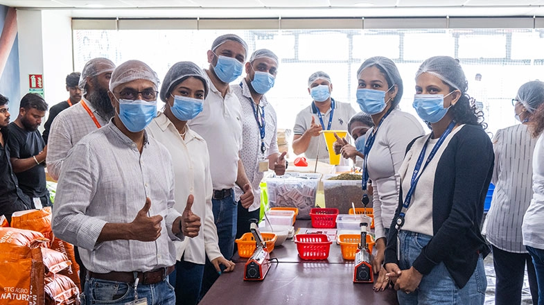 Pfizer colleagues packing meal kits for Rise Against Hunger