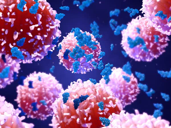 3D illustration of pink cells with blue molecules floating against a dark background