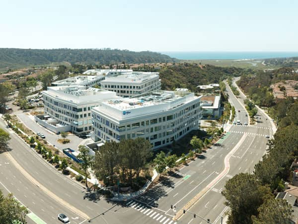 Aerial photo of a large office complex at a highway intersection near the coast