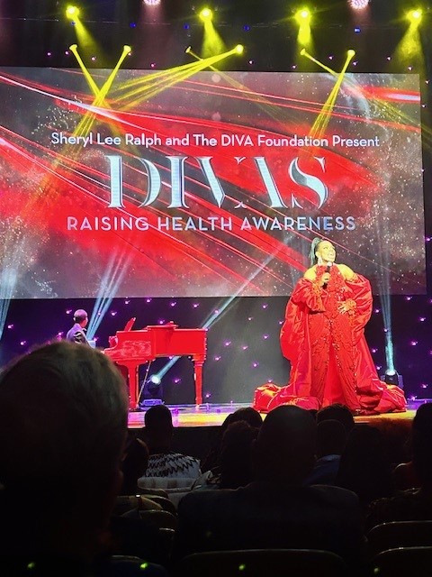 Sheryl Lee Ralph on stage at a pfizer Gala event