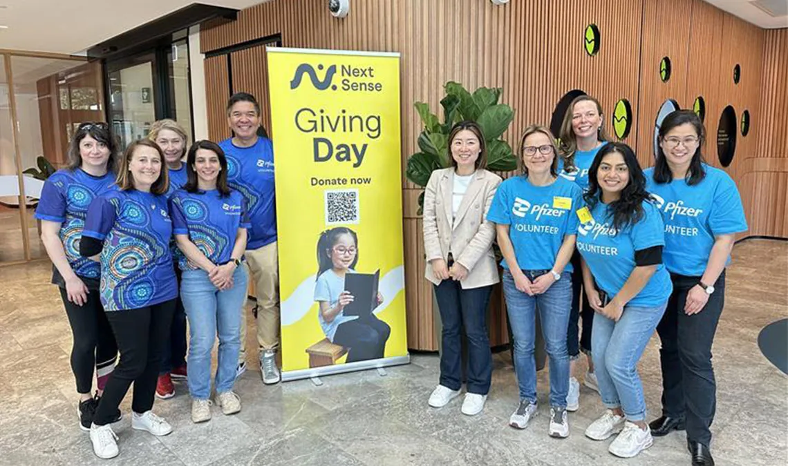 pfizer colleagues - volunteers taking a group photo for 175 days of good