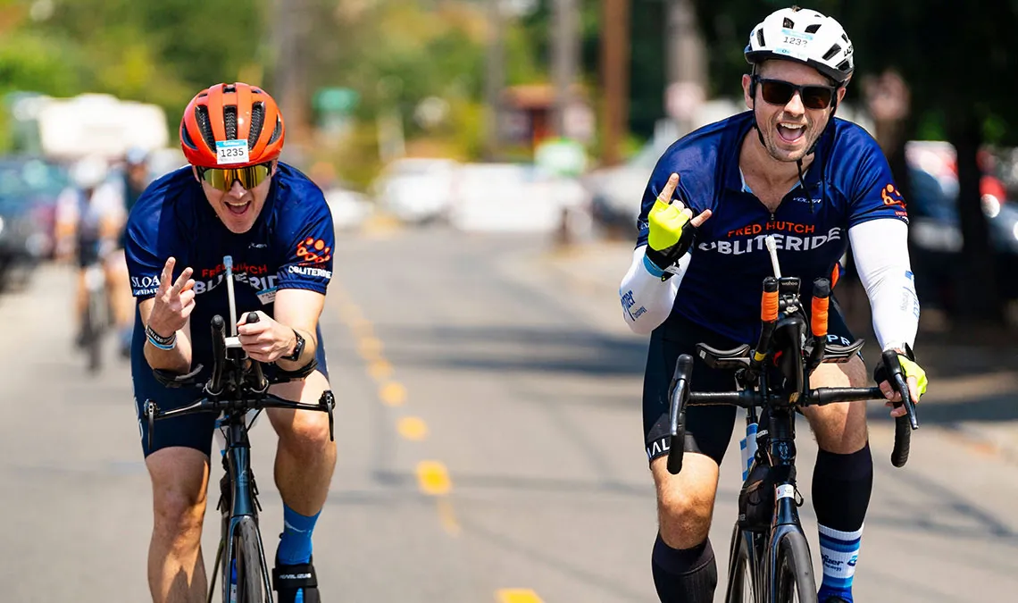 2 bikers volunteers with smiling faces