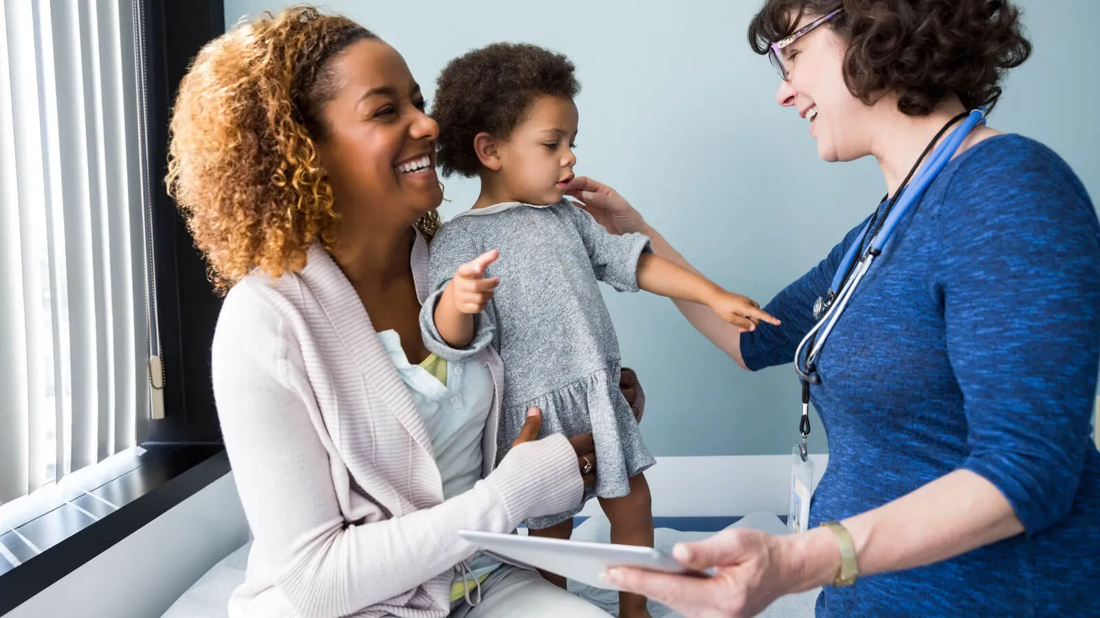 Mother and child with doctor