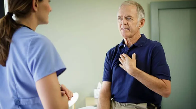 Elderly man speaking with healthcare professional thumbnail