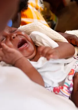 An infant receiving vaccination at a health clinic in one of Rwanda’s most rural districts, Rwamagana
