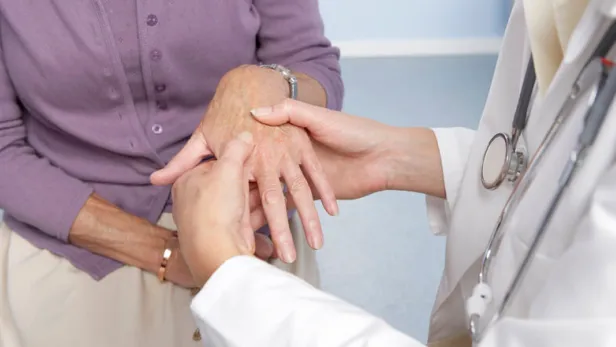 Doctor checking patient hand thumbnail