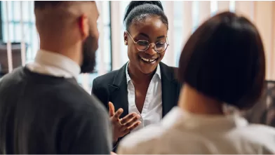 Three people talking