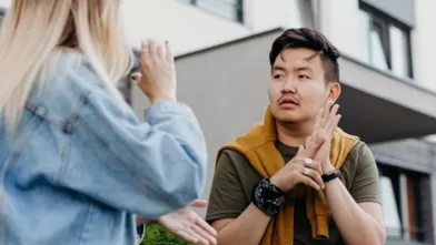 Man and women communicating through sign language