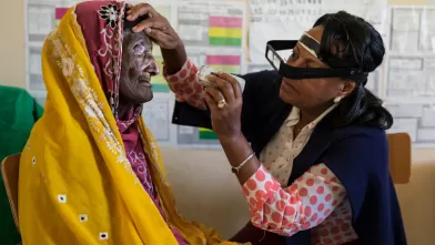 Doctor inspecting patient's eye
