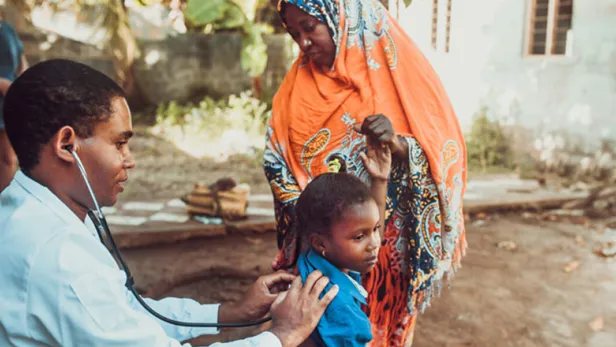 Doctor helping patients outside