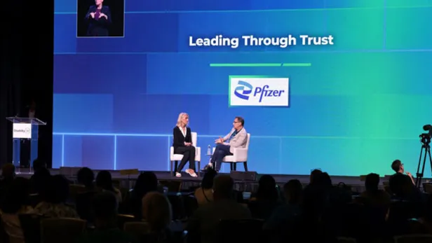 Photograph of two speakers onstage at a Pfizer event titled “Leading Through Trust” thumbnail